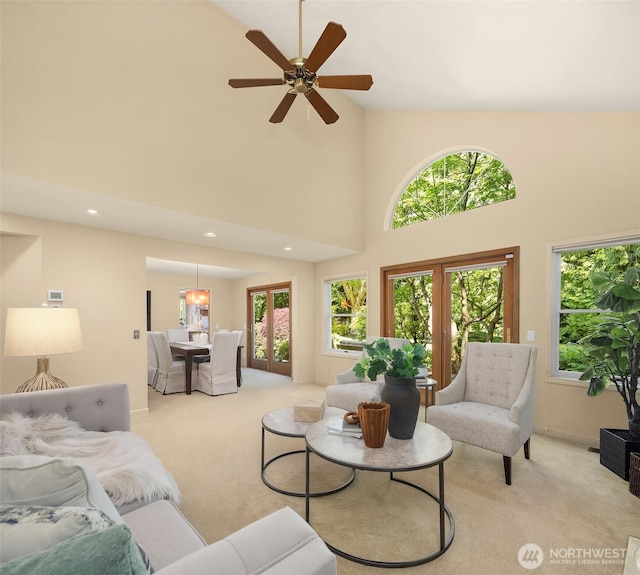 1211 6th Pl S, Edmonds, WA 98020 - living room with light colored carpet, high vaulted ceiling, plenty of natural light, ceiling fan, and recessed lighting