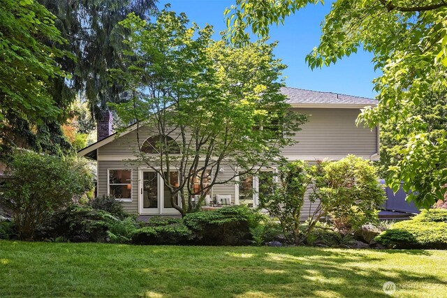 1211 6th Pl S, Edmonds, WA 98020 - view of property hidden behind natural elements featuring a front yard and a chimney