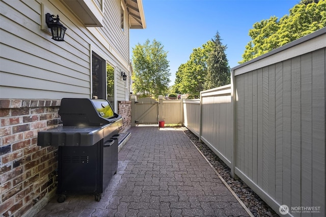 1211 6th Pl S, Edmonds, WA 98020 - view of patio / terrace featuring a gate and a grill