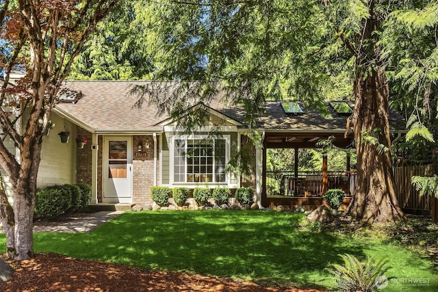 23018 NE 25th Way, Sammamish, WA 98074 - view of front facade featuring a shingled roof, a front yard, and brick siding