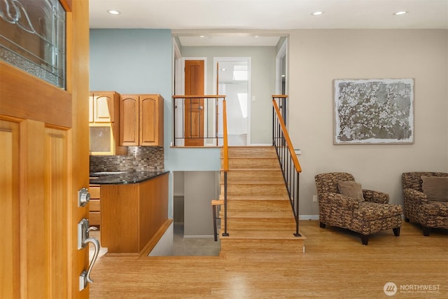 23018 NE 25th Way, Sammamish, WA 98074 - stairs with wood finished floors, recessed lighting, and baseboards