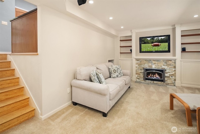 23018 NE 25th Way, Sammamish, WA 98074 - carpeted living room featuring recessed lighting, stairway, baseboards, a stone fireplace, and built in shelves