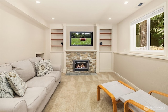 23018 NE 25th Way, Sammamish, WA 98074 - living room with light colored carpet, recessed lighting, built in features, a fireplace, and baseboards