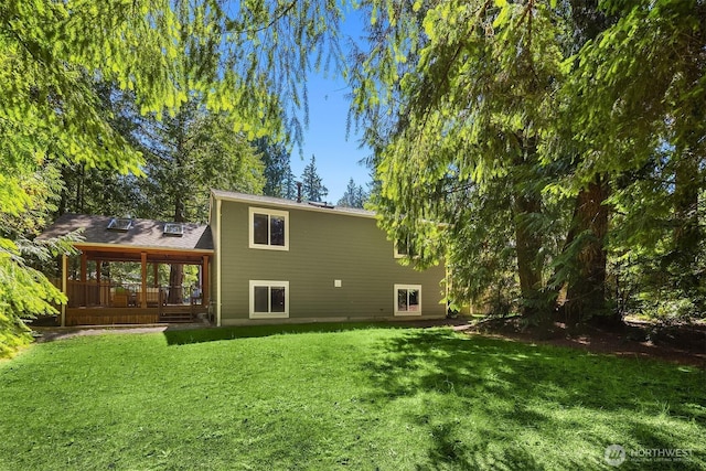 23018 NE 25th Way, Sammamish, WA 98074 - rear view of house with a deck and a lawn