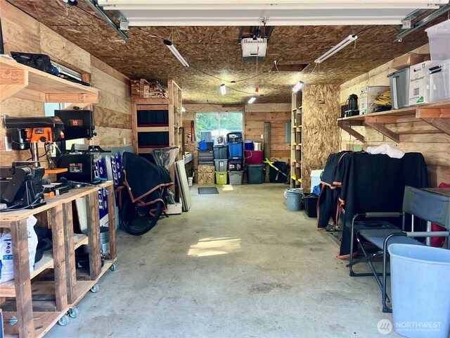 1911 324th, Long Beach, WA 98631 - garage featuring a garage door opener and a workshop area