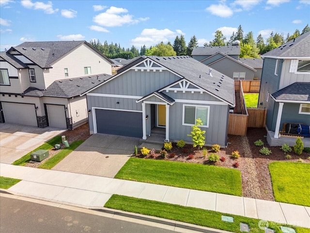 4413 NE 182nd St Unit 111, Vancouver, WA 98686 - view of front of house with board and batten siding, driveway, and a shingled roof