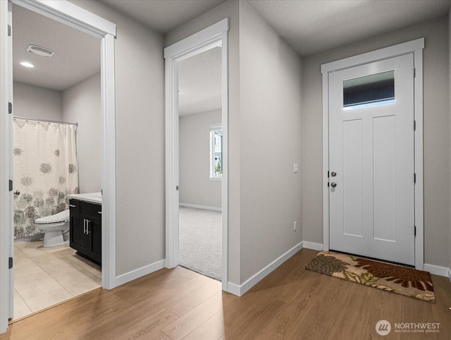 4413 NE 182nd St Unit 111, Vancouver, WA 98686 - foyer entrance with light wood finished floors and baseboards