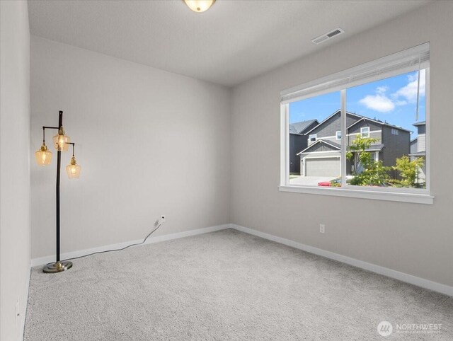 4413 NE 182nd St Unit 111, Vancouver, WA 98686 - empty room with carpet and baseboards