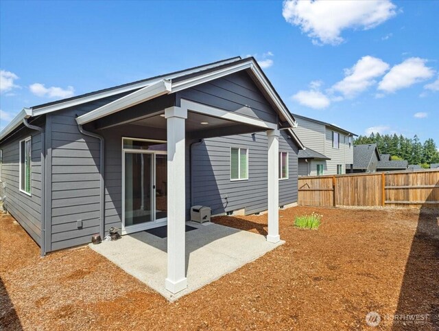 4413 NE 182nd St Unit 111, Vancouver, WA 98686 - rear view of house with a patio area