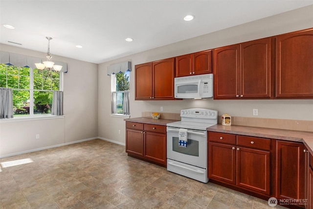 8315 Vashon Dr NE, Lacey, WA 98516 - kitchen with white appliances, plenty of natural light, baseboards, a chandelier, and recessed lighting