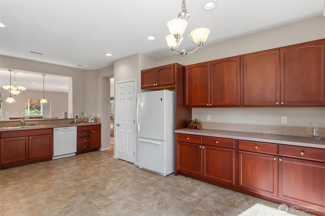8315 Vashon Dr NE, Lacey, WA 98516 - kitchen featuring white appliances, a chandelier, a sink, pendant lighting, and recessed lighting