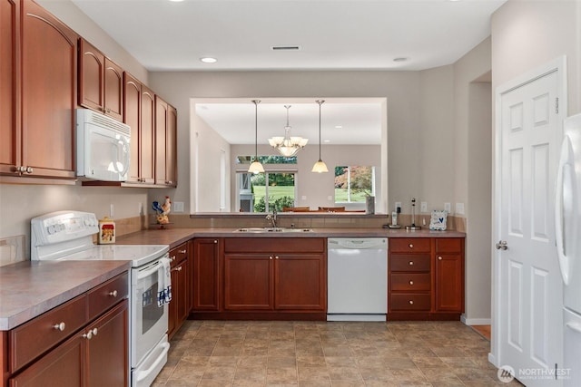 8315 Vashon Dr NE, Lacey, WA 98516 - kitchen with white appliances, a sink, hanging light fixtures, a chandelier, and recessed lighting