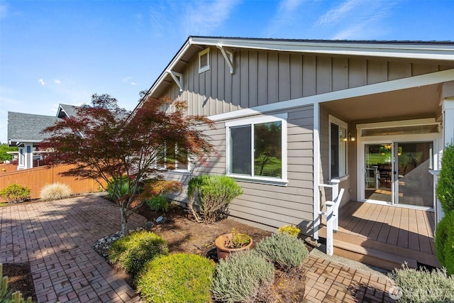 8315 Vashon Dr NE, Lacey, WA 98516 - view of side of home featuring a deck, board and batten siding, and a patio