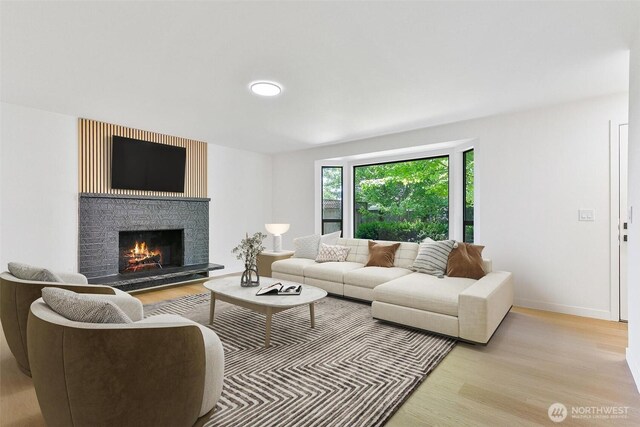 5410 240th St SW, Mountlake Terrace, WA 98043 - living area featuring light wood-style flooring and a fireplace