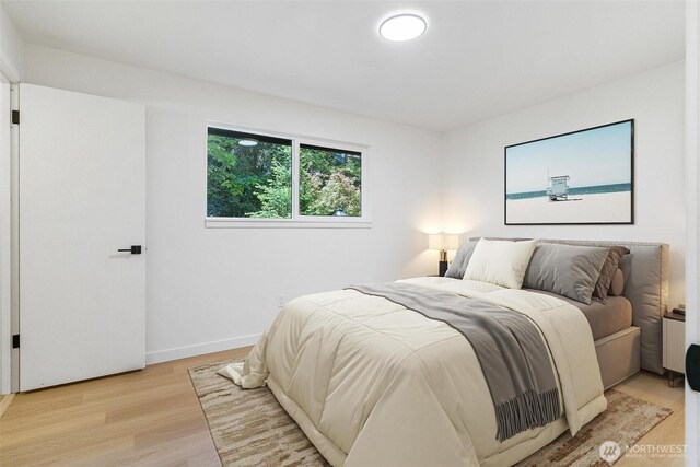 5410 240th St SW, Mountlake Terrace, WA 98043 - bedroom with light wood-style floors and baseboards