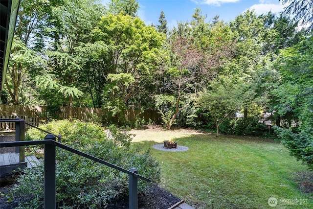 5410 240th St SW, Mountlake Terrace, WA 98043 - fenced backyard with an outdoor fire pit