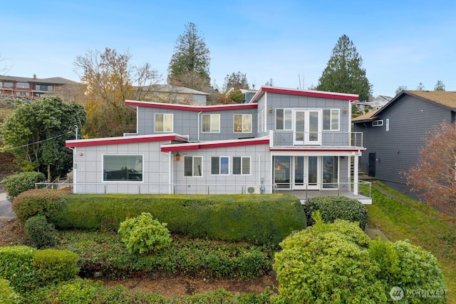 10445 Dixon Dr S, Seattle, WA 98178 - back of property featuring board and batten siding and a sunroom