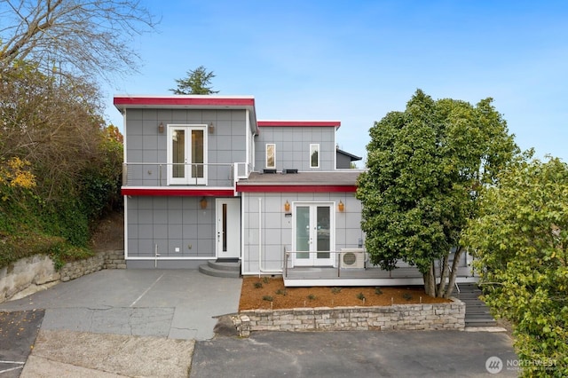 10445 Dixon Dr S, Seattle, WA 98178 - contemporary home featuring french doors and a balcony