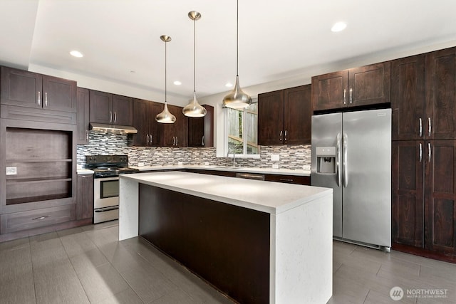 10445 Dixon Dr S, Seattle, WA 98178 - kitchen with stainless steel appliances, tasteful backsplash, dark brown cabinetry, light countertops, and recessed lighting