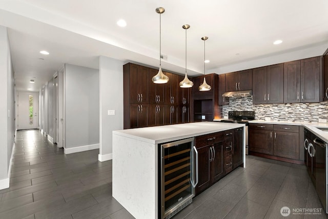 10445 Dixon Dr S, Seattle, WA 98178 - kitchen featuring wine cooler, stainless steel electric range oven, under cabinet range hood, baseboards, and backsplash
