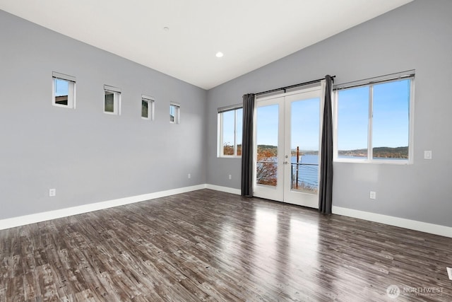 10445 Dixon Dr S, Seattle, WA 98178 - spare room with vaulted ceiling, wood finished floors, baseboards, and french doors