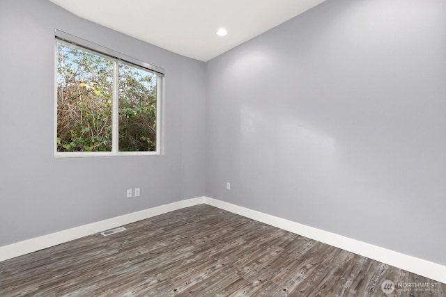 10445 Dixon Dr S, Seattle, WA 98178 - spare room with dark wood finished floors, baseboards, and recessed lighting