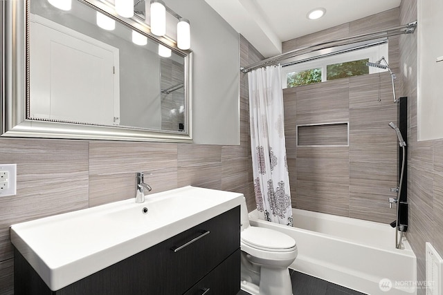 10445 Dixon Dr S, Seattle, WA 98178 - full bathroom with tile walls, toilet, vanity, and shower / bathtub combination with curtain