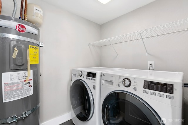 10445 Dixon Dr S, Seattle, WA 98178 - laundry area featuring strapped water heater, independent washer and dryer, and baseboards