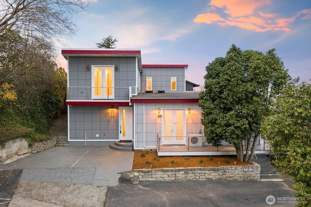 10445 Dixon Dr S, Seattle, WA 98178 - modern home featuring french doors and a balcony