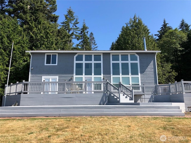3060 NE Wheeler St, Poulsbo, WA 98370 - rear view of property with a yard and a wooden deck