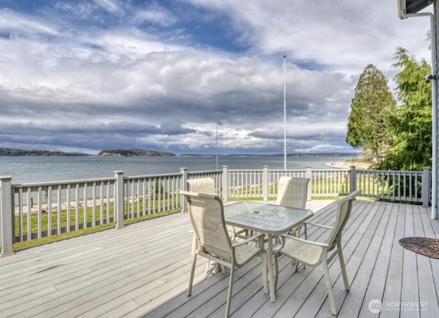 3060 NE Wheeler St, Poulsbo, WA 98370 - wooden terrace featuring outdoor dining area and a water view