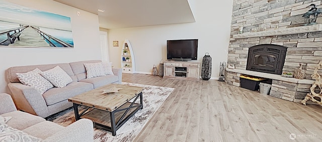 3060 NE Wheeler St, Poulsbo, WA 98370 - living room featuring wood finished floors, baseboards, a fireplace, and recessed lighting