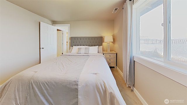 3060 NE Wheeler St, Poulsbo, WA 98370 - bedroom with baseboards and light colored carpet