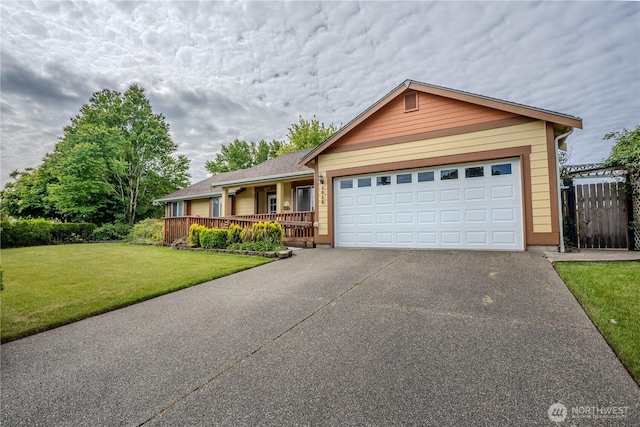1015 Rockcress Dr SE, Olympia, WA 98513 - ranch-style house featuring a front yard, concrete driveway, covered porch, and an attached garage
