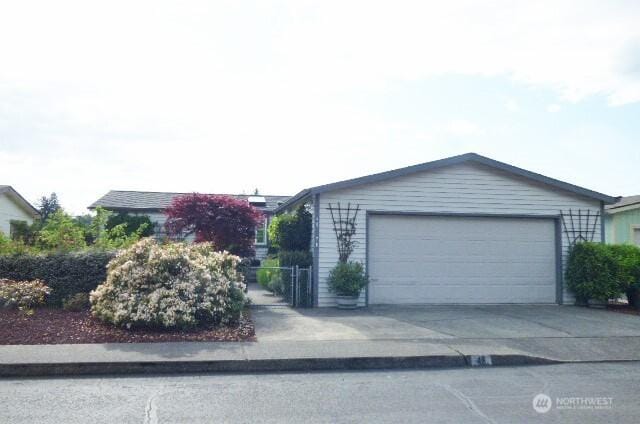 716 Dennis St SE Unit 48, Tumwater, WA 98501 - ranch-style house featuring concrete driveway and an attached garage