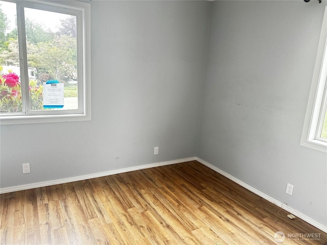 620 Hull Ave, Port Orchard, WA 98366 - spare room featuring baseboards and wood finished floors