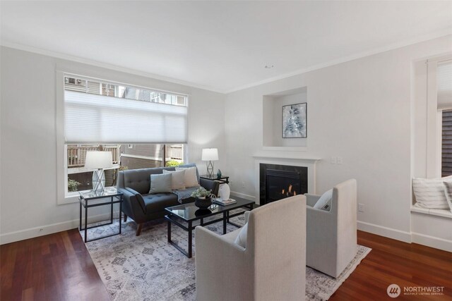 1126 24th Ave, Seattle, WA 98122 - living room with a glass covered fireplace, baseboards, crown molding, and wood finished floors