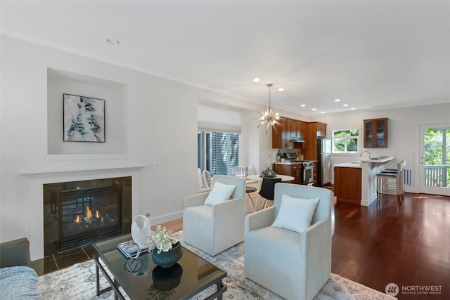 1126 24th Ave, Seattle, WA 98122 - living area with dark wood-style flooring, recessed lighting, a high end fireplace, baseboards, and a chandelier