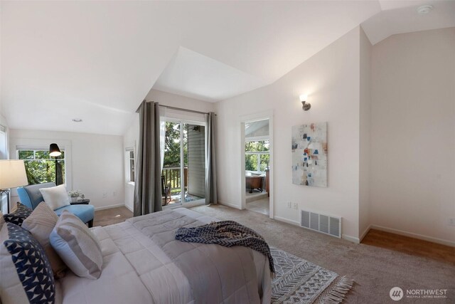 1126 24th Ave, Seattle, WA 98122 - bedroom with lofted ceiling, multiple windows, access to outside, carpet flooring, and baseboards