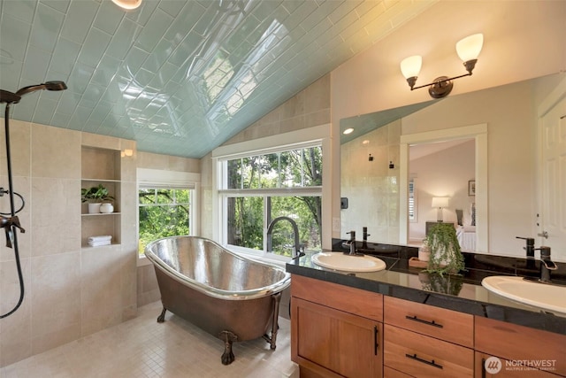 1126 24th Ave, Seattle, WA 98122 - full bathroom with double vanity, a freestanding bath, tiled shower, lofted ceiling, and tile patterned floors