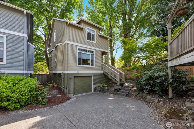 1126 24th Ave, Seattle, WA 98122 - view of front of house with stairway, driveway, and a garage