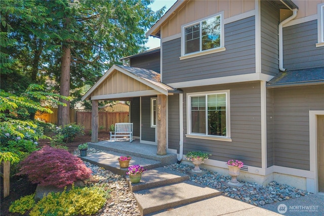 7203 Myers Rd E, Bonney Lake, WA 98391 - view of front facade featuring roof with shingles, covered porch, and board and batten siding
