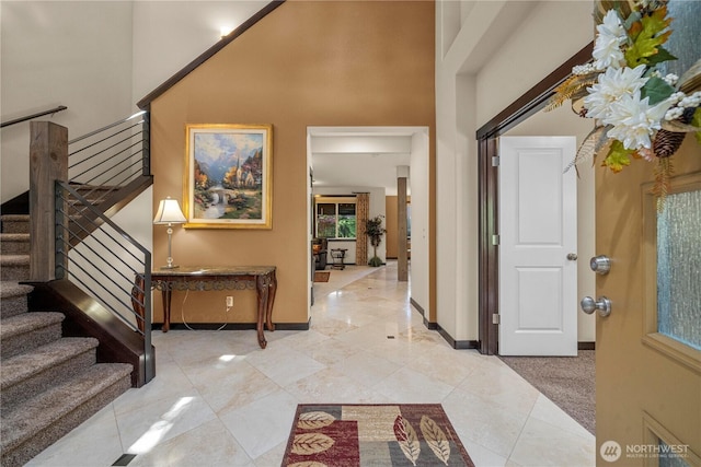 7203 Myers Rd E, Bonney Lake, WA 98391 - foyer entrance with light tile patterned flooring, stairway, baseboards, and a high ceiling