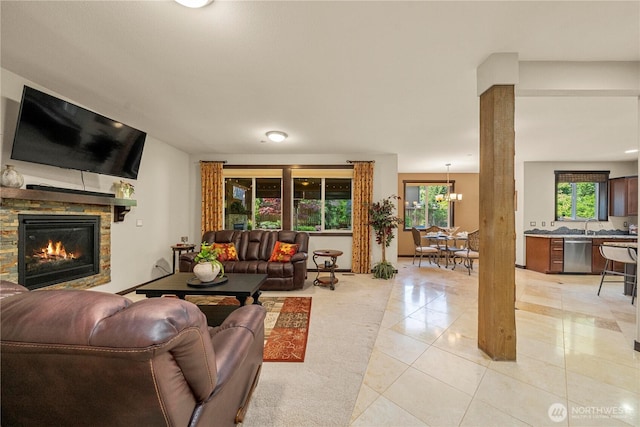 7203 Myers Rd E, Bonney Lake, WA 98391 - living area with light tile patterned floors and a stone fireplace