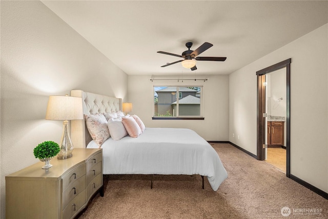 7203 Myers Rd E, Bonney Lake, WA 98391 - bedroom with light colored carpet, baseboards, ensuite bath, and a ceiling fan