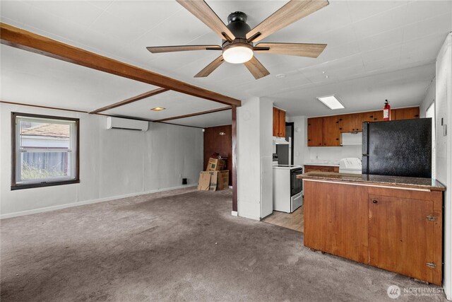 4222 S Spencer St, Seattle, WA 98118 - kitchen featuring freestanding refrigerator, range, a wall unit AC, open floor plan, and light colored carpet