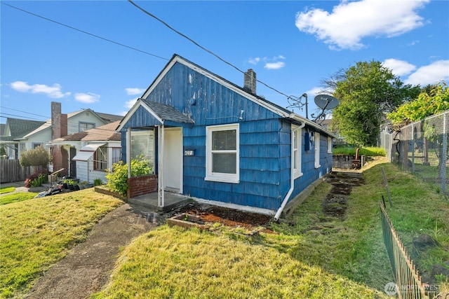 4222 S Spencer St, Seattle, WA 98118 - view of front facade featuring a chimney