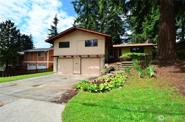18215 108th Ave NE, Bothell, WA 98011 - tri-level home featuring driveway, an attached garage, and a front yard