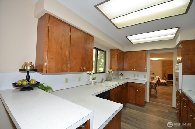 18215 108th Ave NE, Bothell, WA 98011 - kitchen with light countertops, a sink, oven, and brown cabinetry