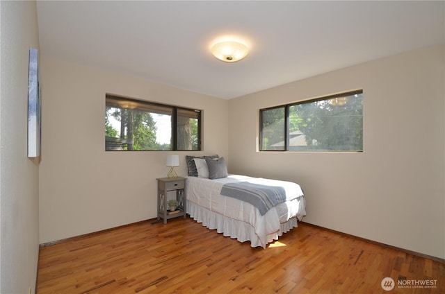 18215 108th Ave NE, Bothell, WA 98011 - bedroom featuring light wood-style flooring and baseboards